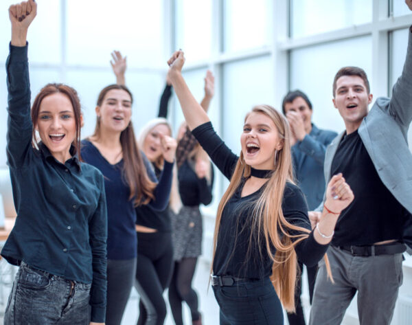 group-happy-employees-standing-with-their-hands-up (1)